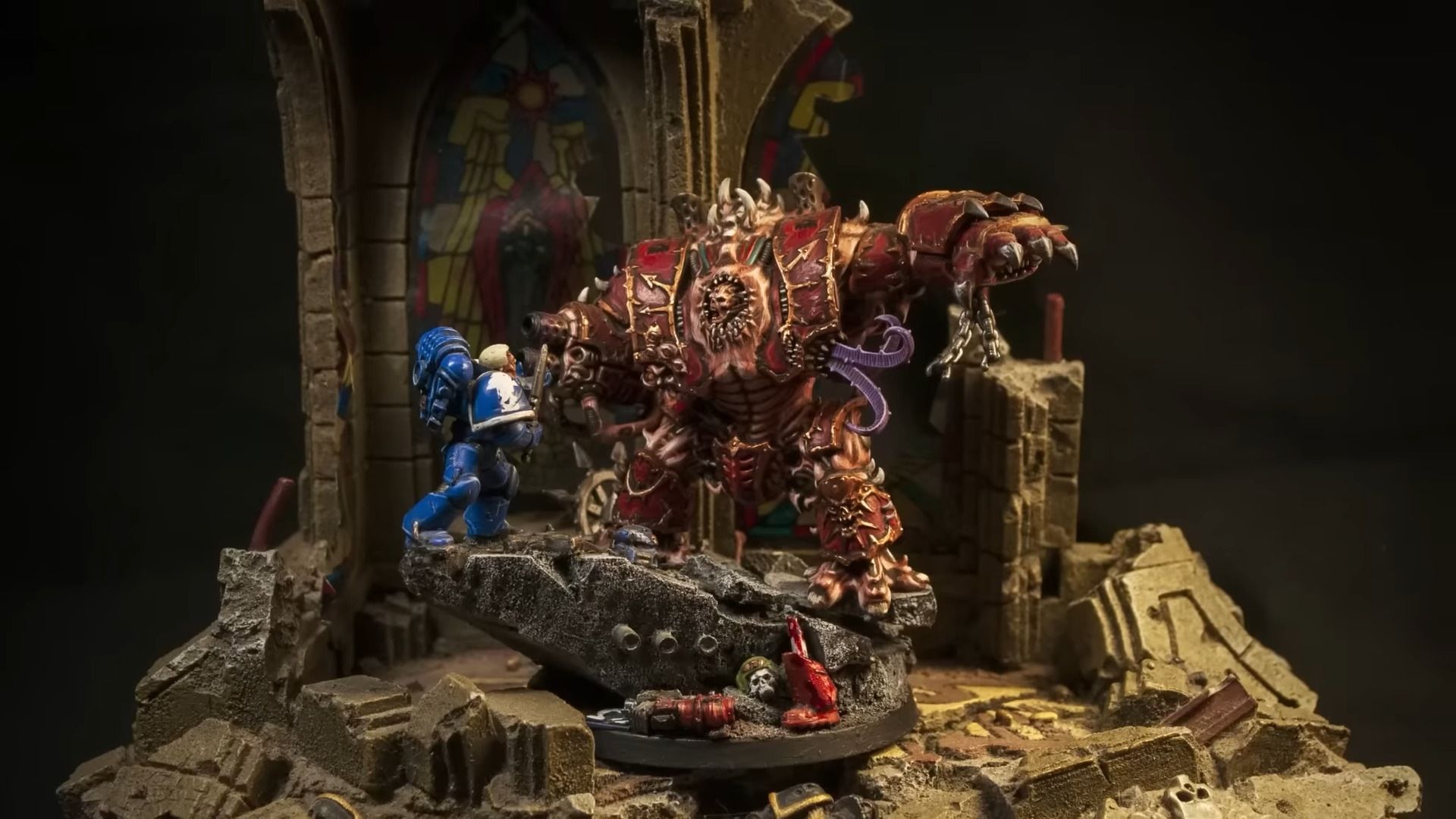 A Hellbruite Model Fighting a Space Marine
